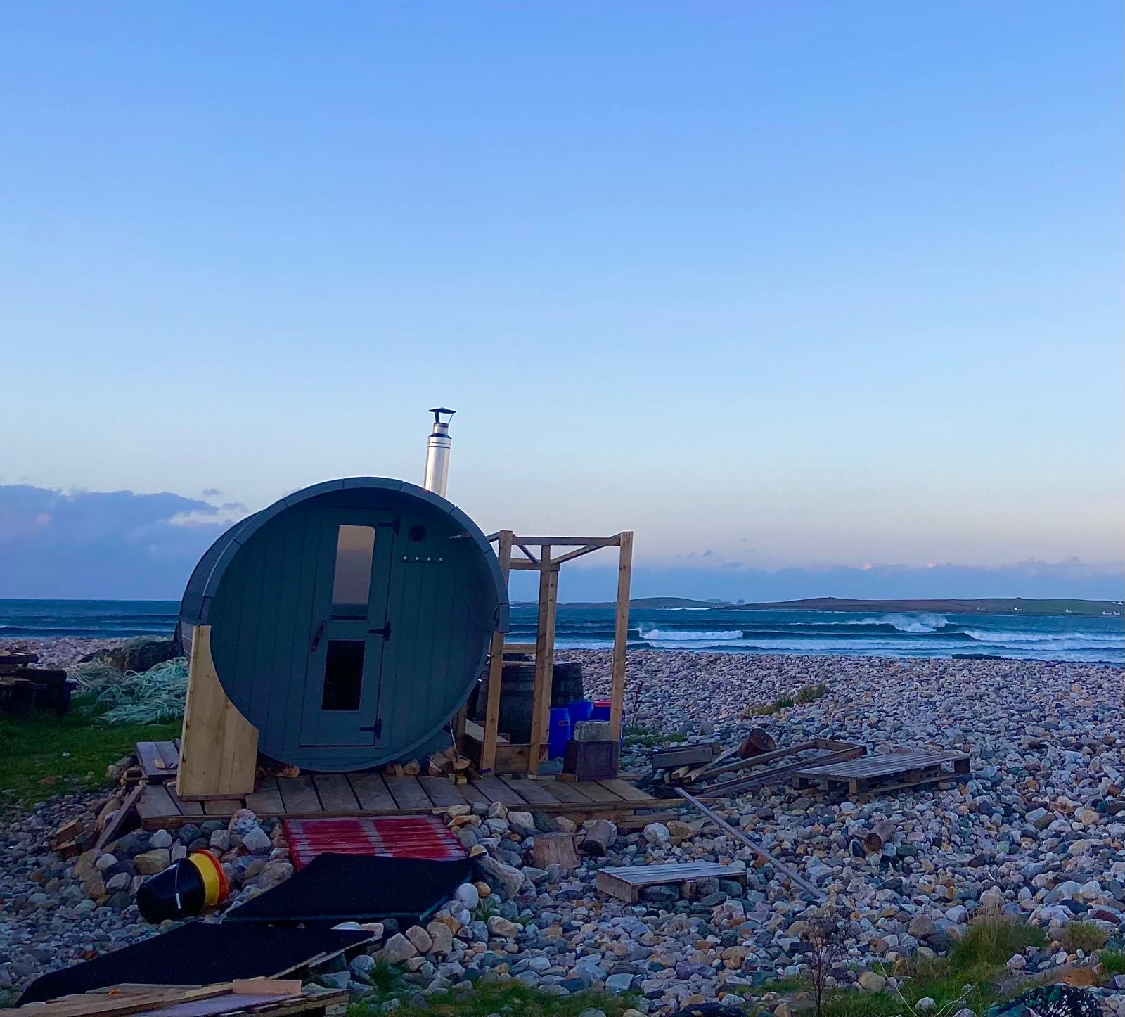 A beach sauna at sunset