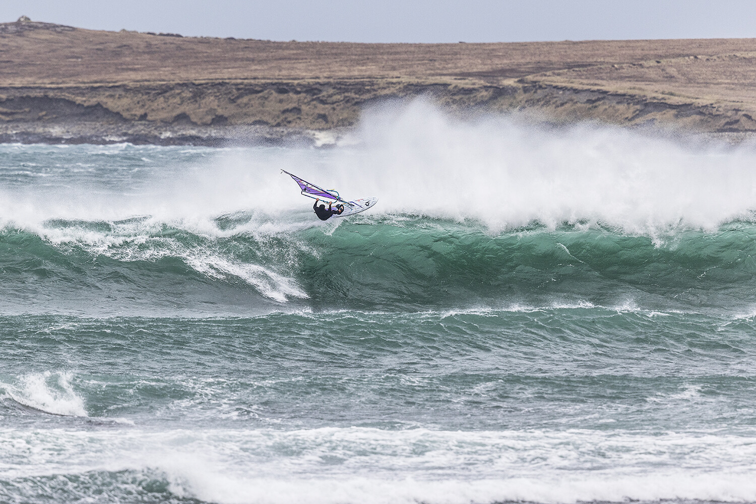 Windsurfing action shot, aerial off the lip