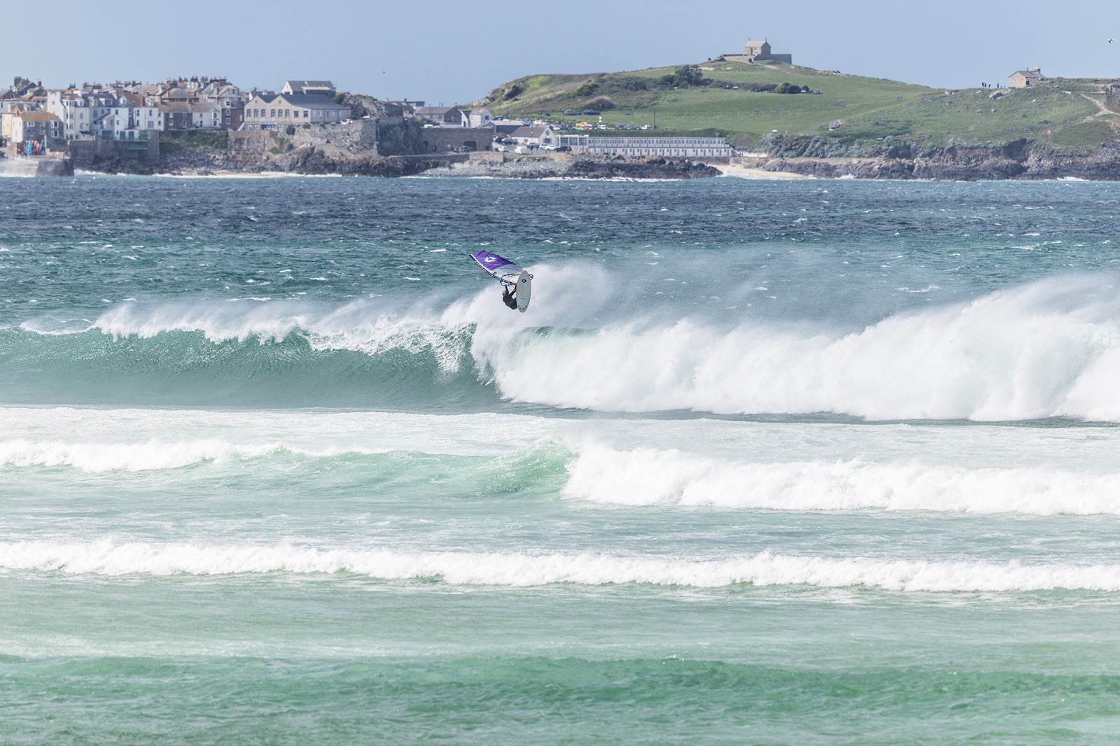 Windsurfing action shot with St Ives, Cornwall in the background